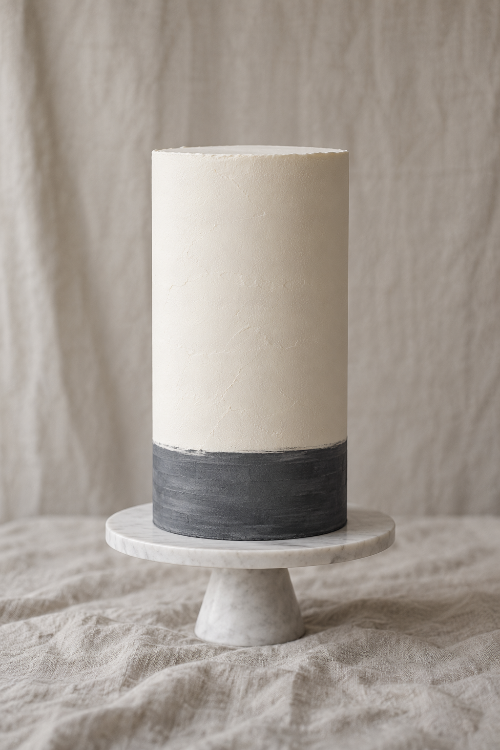 Single tall tier in chalk-white matte finish, one charcoal band at the foot.